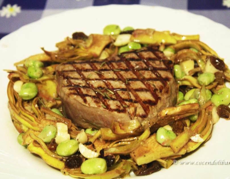 Filetto con carciofi, fave, mandorle e uva passa