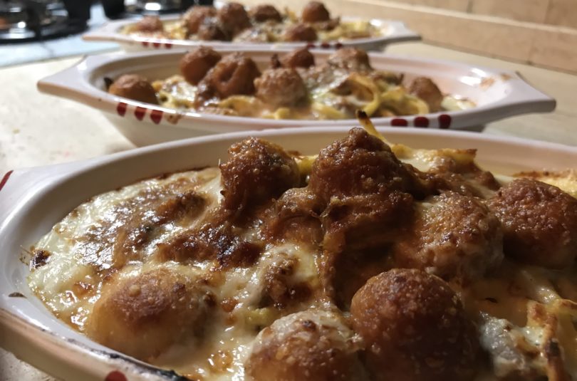 Chitarra gratinata al ristretto di agnello e curry con pallottine