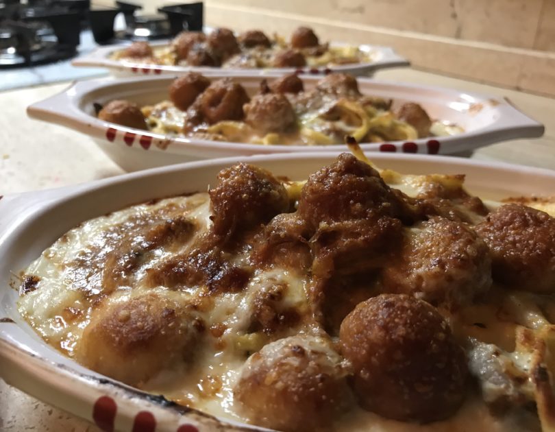 Chitarra gratinata al ristretto di agnello e curry con pallottine