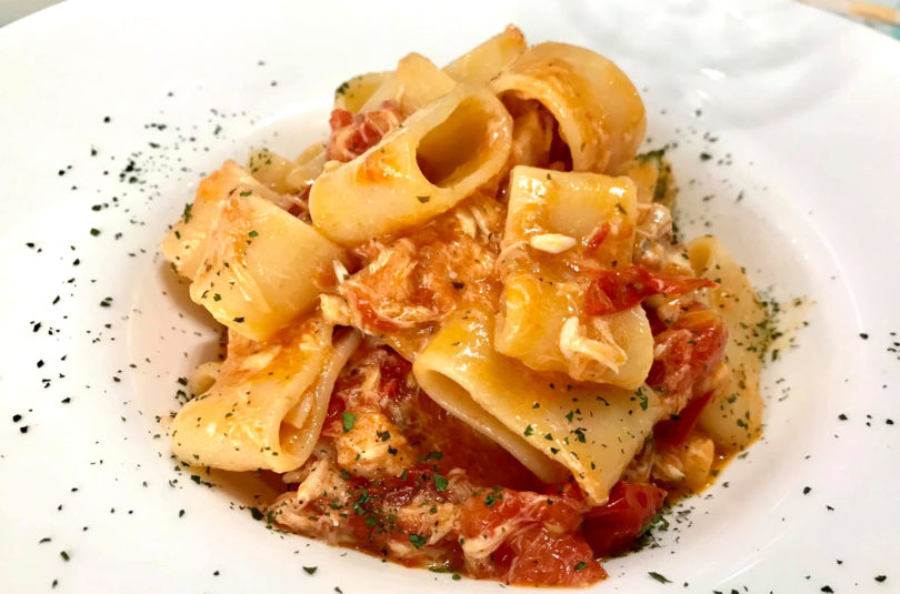Calamarata con scorfano e datterini